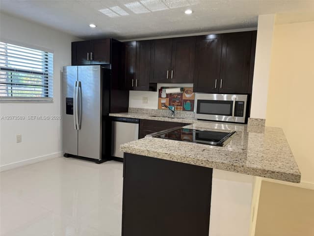 6095 N Sabal Palm Blvd # 103, Tamarac FL 33319 - Tamarac, FL - Photo 2
