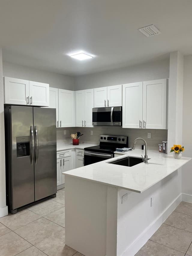 4414 WOODLAND Circle, Tamarac FL 33319 - Tamarac, FL - Photo 5